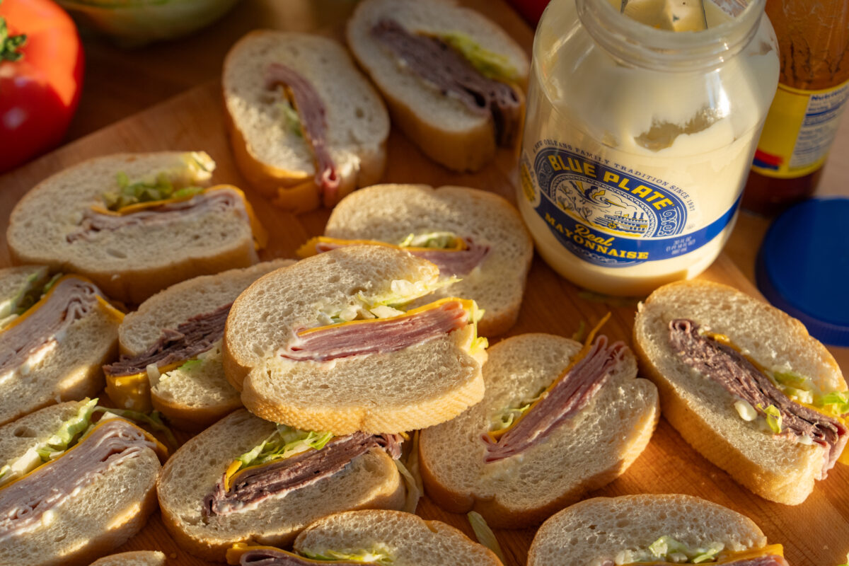 mini po-boy slices arranged on a cutting board